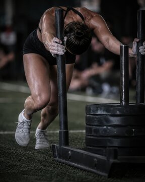 Female Athlete Pushing Sled in Gym Generative AI Commercial Fitness Training