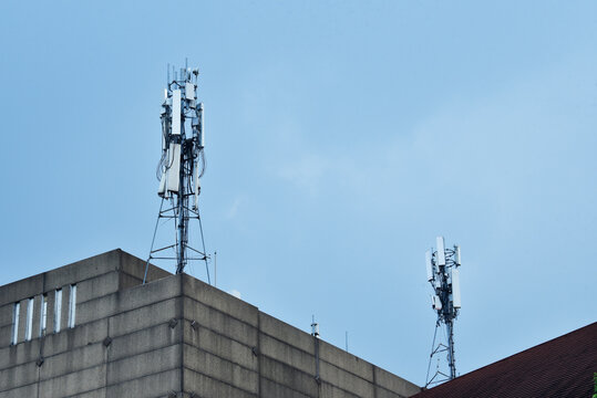 BTS (Base Transceiver Station) towers function to expand the range of cellular signals. The tower structure is equipped with various types of antennas, including panel antennas for cellular networks a