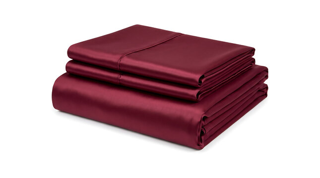Neatly folded burgundy satin bed sheet set isolated on white