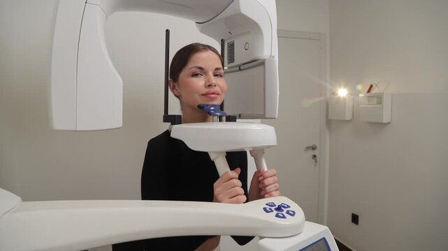 Woman patient undergoing dental panoramic x-ray scan