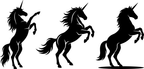 Three unicorn silhouettes rearing with flowing manes and tails, symbolizing mythical elegance, motion, fantasy, and magical creatures © mokbul