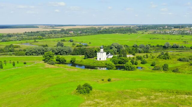 Russia, Bogolyubovo. Drone footage of Church of the Intercession on the Nerl. Orthodox church and a symbol of medieval Russia. Drone footage, Point of interest