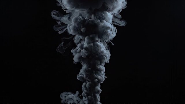 Gray ink plume rising in dark liquid against black background