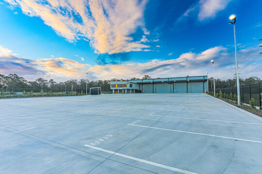 Large distribution centre photographed during evening light with expansive hardstand, loading infrastructure and modern warehouse design.