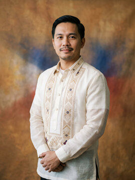 Filipino man wearing a barong tagalog stands for a formal studio portrait used for cultural heritage campaigns, ethnic fashion editorials and diplomatic identity