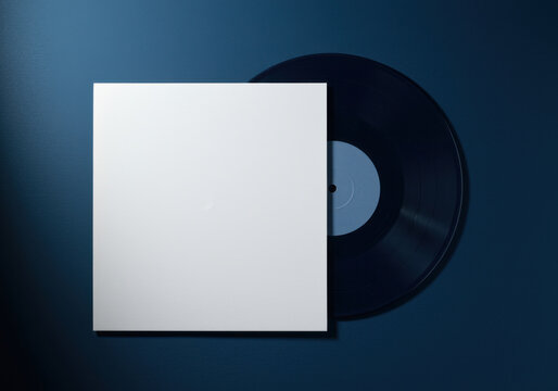 White square paper sleeve with black vinyl record disc on blue background for music album branding, audio industry mockup and minimalist sound design template