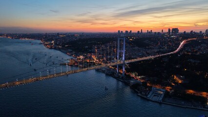 Naklejka premium Bosphorus Bridge Under a Crimson Evening Sky