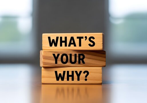 Motivational wooden blocks asking what is your purpose and reason for success in professional setting