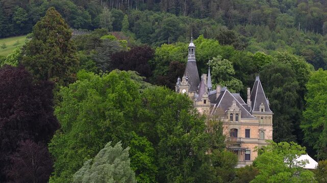 Castle Hunegg fairytale castle in a forest along lake Tune.