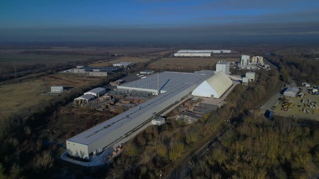 Industrial factory complex production Gipsum drywall. Dramatic aerial view drone