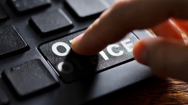 Keys on a keyboard show message out of office on a wooden table during daytime