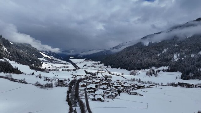 Forward Drone Flight Over Snow-Covered Village of Maiern in Val Ridanna at 1600 m, South Tyrol, Italy