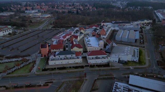 large shopping village outlet center complex, winter. Dramatic aerial view drone
