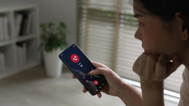 Woman calling emergency number 911 for crisis situation