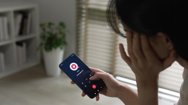 Sick woman calling emergency number for ambulance