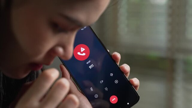 Woman calling emergency number 911 for crisis situation