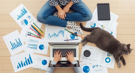 Woman and cat working on laptop with financial charts
