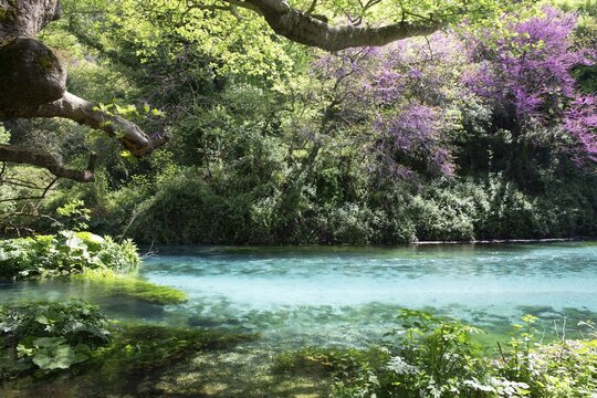 Mountain lake Syri i Kalt&euml;r, karst spring, underground terrain or so-called karst cave in carbonate rock formed by weathering, called the blue eye, Krongj, Albania