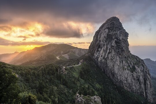 View of the Roque de Agando rock tower, one of La Gomera's landmarks, from the Mirador Roque de Agando. Sunrise, good weather. Monumento Natural de Los Roques, La Gomera, Canary Islands, Spain