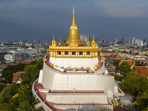 Bangkok, Thailand - 26 April 2026: Aerial view of Wat Saket Ratchawora Mahawihan, also known as the Golden Mount, with its iconic golden chedi rising above the city skyline.