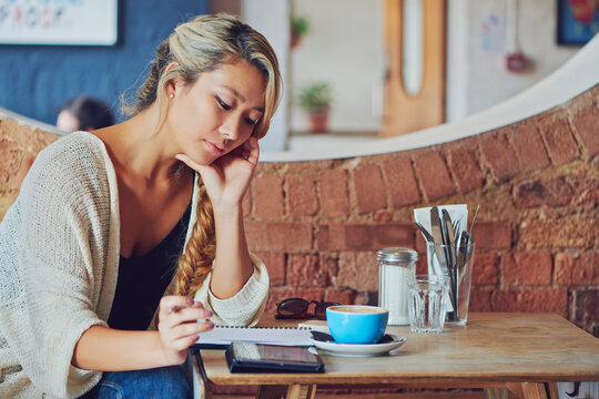 Planning, remote work and woman with tablet in coffee shop, reading feedback and research for script. Review, freelance and writer with tech for screenplay revision, plot idea and creativity in cafe