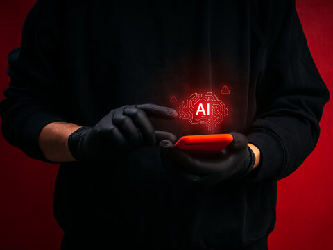 Cybercriminal using smartphone with AI brain powered scam interface and digital warning alerts. Concept of AI fraud, cybercrime, phishing attack, online deception and artificial intelligence threats.