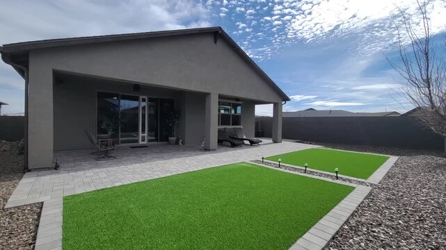 Modern backyard with patio and gravel path