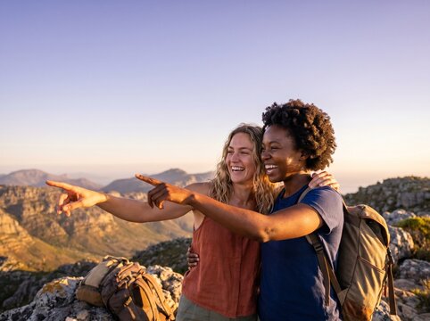 Ultra-Wide Panoramic Shot of Diverse Friends Embracing on Mountain Summit - Freedom and Copy Space