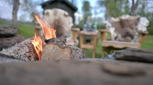 Outdoor fireplace for recreation in the forrest at a wooden cabin. 