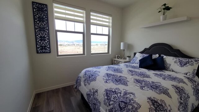 Cozy blue-toned bedroom with daylight through blinds