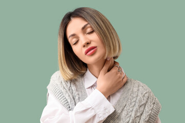 Fototapeta premium Stylish young woman with short hair on green background