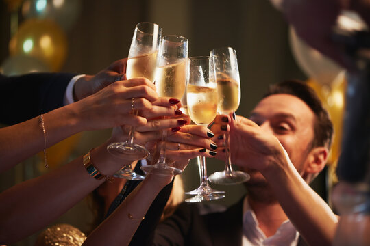 Cheers, luxury or hands at party with champagne, good time or friendship bonding at reunion event. Happy, glamour or people with drinks toast, get together or celebration moment at gala gathering.