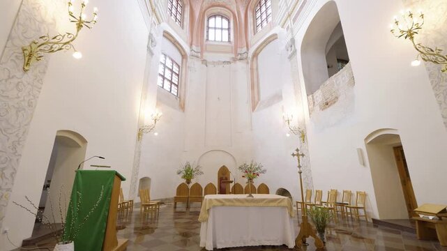 Vilnius, Lithuania &ndash; June 10, 2026: Smooth cinematic movement through the Church of the Assumption of the Blessed Virgin Mary showcasing the altar