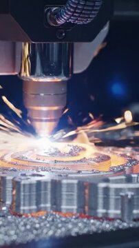 Intricate Metal Cutting Process Captured Showing Precision Laser Technology and Spark Creation in Action with Bright Flashes of Light and Metal Shavings