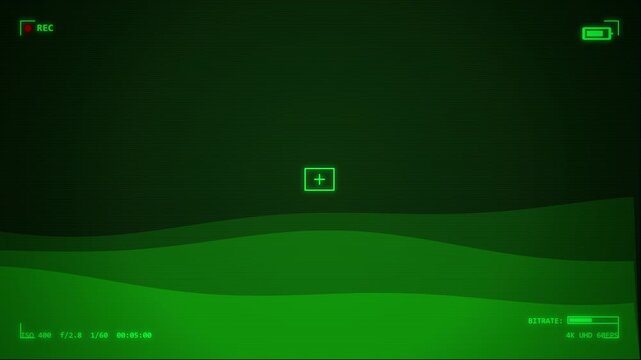 Night vision scope view with targeting reticle over dark landscape