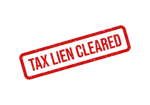 Red tax lien cleared stamp or seal with bold white text