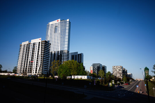 Modern Atal Olimpijska residential and commercial skyline in Katowice, Poland with high rise apartment towers and glass office skyscraper under a clear blue sky