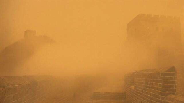 Great Wall of China in severe sandstorm - Climate change and air pollution concept