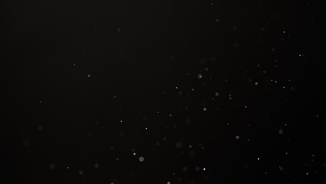 Slow motion real dust flow over dark background
