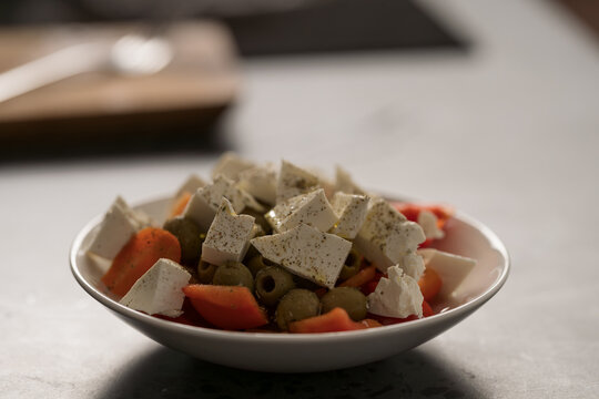Greek style salad with tomatoes, bell pepper, olives and feta cheese