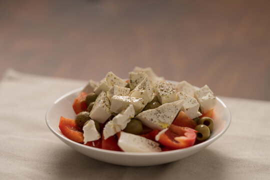 Greek style salad with tomatoes, bell pepper, olives and feta cheese