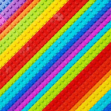 A vibrant, top-down macro view of colorful toy building bricks arranged in crisp, diagonal rainbow stripes for a playful, textured geometric background.