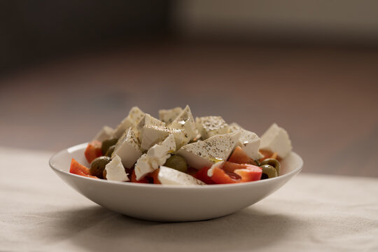 Greek style salad with tomatoes, bell pepper, olives and feta cheese