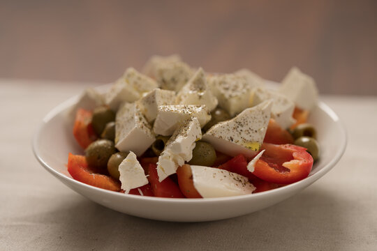 Greek style salad with tomatoes, bell pepper, olives and feta cheese