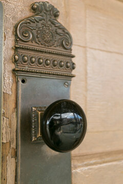 Antique doorknob detail on an old western building
