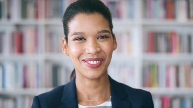 Smile, professional and face of woman in library for laughing, manuscript editor or writer. Publishing agency, happy and bookshelf with female person in book store for pride, joke and author