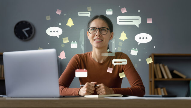 Woman managing digital overload with multiple notifications and multitasking at desk