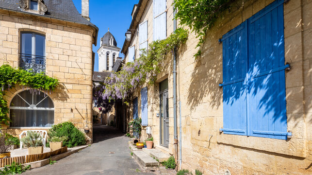 Old townhouses in the rue du Marteau in the historic center of Montignac, France, the village in the V&eacute;z&egrave;re valley where the Lascaux cave is located, on a sunny spring day.