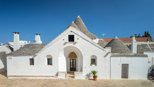Beautiful Trullo Sovrano at sunny day in Alberobello, Puglia, Italy