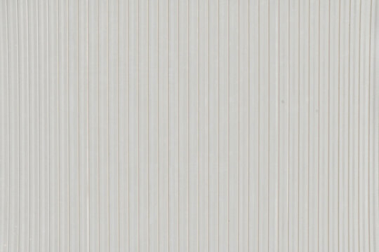 Textured white background with subtle vertical stripes.